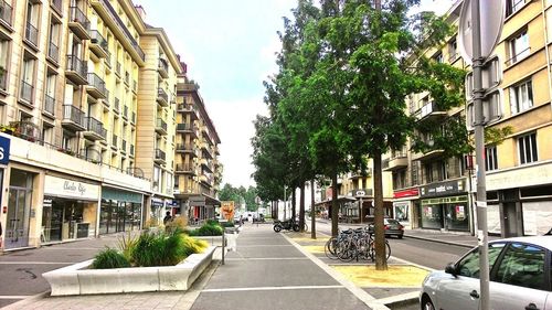 City street amidst buildings against sky