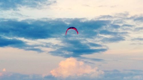 Low angle view of paragliding against sky