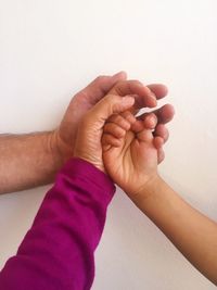 Close-up of couple holding hands