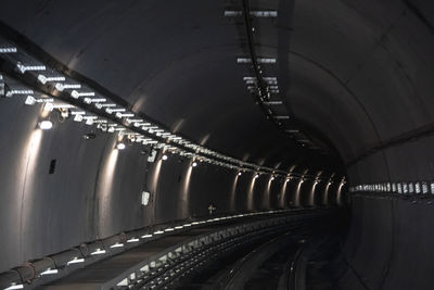 Low angle view of illuminated tunnel