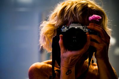 Portrait of woman photographing