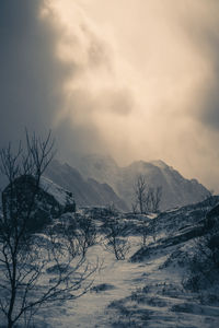 Scenic view of snowcapped mountains against sky during sunset