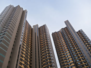 Low angle view of modern buildings against sky