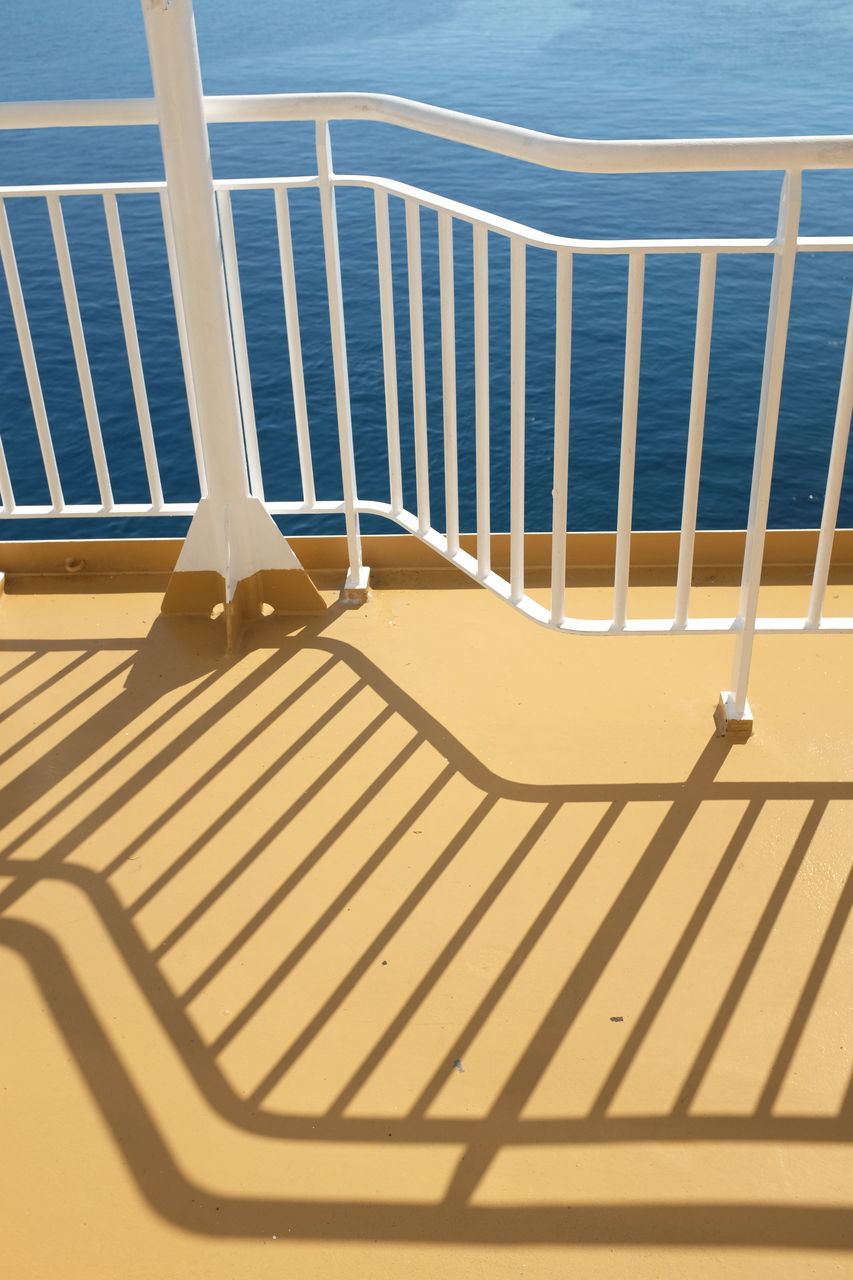 HIGH ANGLE VIEW OF SHADOW ON BEACH