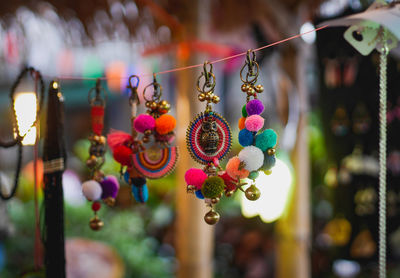 Close-up of decoration hanging for sale in market