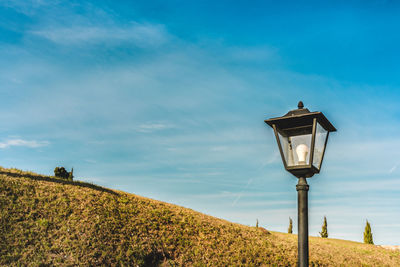 Low angle view of street light against sky