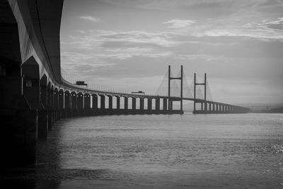 Bridge over sea against sky