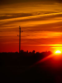Scenic view of silhouette landscape against romantic sky at sunset