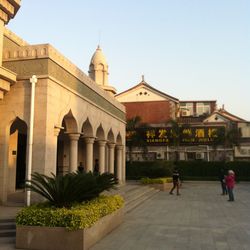 People in temple against clear sky