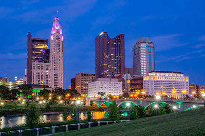 Illuminated buildings in city at night