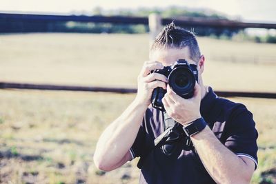 Portrait of man photographing