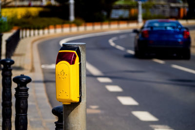 Traffic light button at a pedestrian crossing. pedestrian push button on a city road.