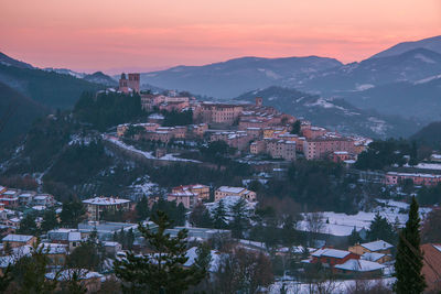 Aerial view of townscape against sky during sunset