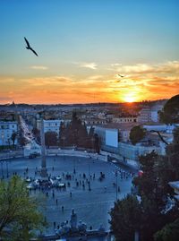 High angle view of city during sunset