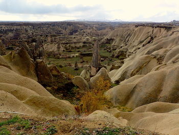 Scenic view of landscape against cloudy sky