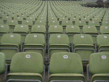 Empty green chairs at stage theater