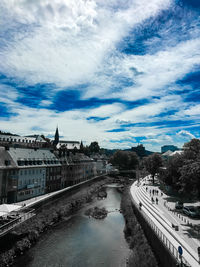 Road by river against sky