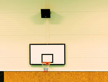 School gym with basketball board and basket. basketball hoop in the high school gym