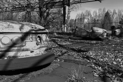 Abandoned boats moored on shore