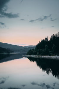 Scenic view of lake against sky during sunset