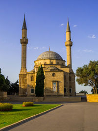 Low angle view of mosque against clear sky