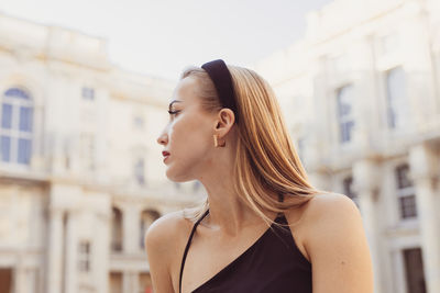 Side view of young woman looking away