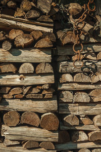 Detail of a pile of cut rustic wood in a sunny day, forming a singular background. brazil.