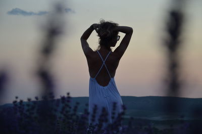 Rear view of woman walking outdoors