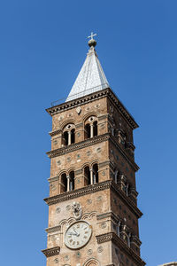 Low angle view of clock tower against sky