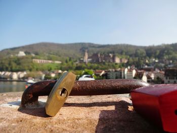 Close-up of lock with castle of heidelberg in the background