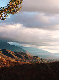 Scenic view of landscape and mountains against sky