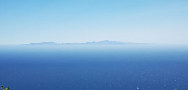 Scenic view of island against sky