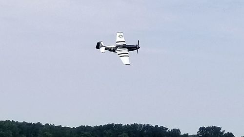 Low angle view of airplane flying against clear sky