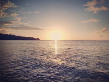 Scenic view of sea at sunset