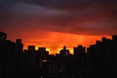 Silhouette of city at sunset