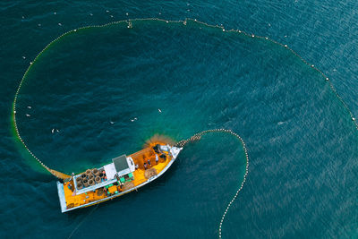 High angle view of ship amidst sea