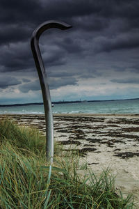 View of calm sea against cloudy sky