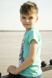 Portrait of boy on sea shore