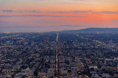 Aerial view of city during sunset