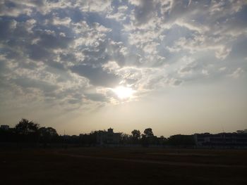 Scenic view of field against sky during sunset