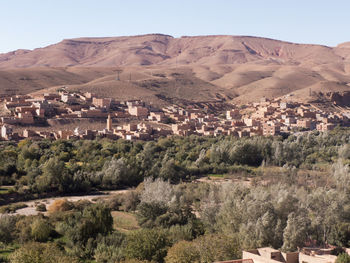 High angle view of buildings and mountains against sky