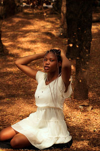 Young woman looking at camera in forest