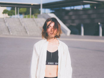 Portrait of woman standing outdoors