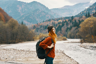 Full length of young woman standing on land