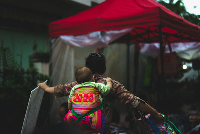 Rear view of girl with umbrella