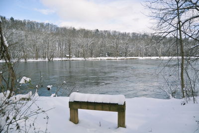 Scenic view of frozen lake against sky during winter