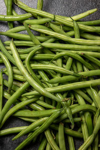 High angle view of green chili peppers at market