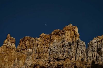 Low angle view of rock formations