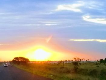 Scenic view of sunset over land