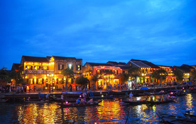 Illuminated buildings in city at night